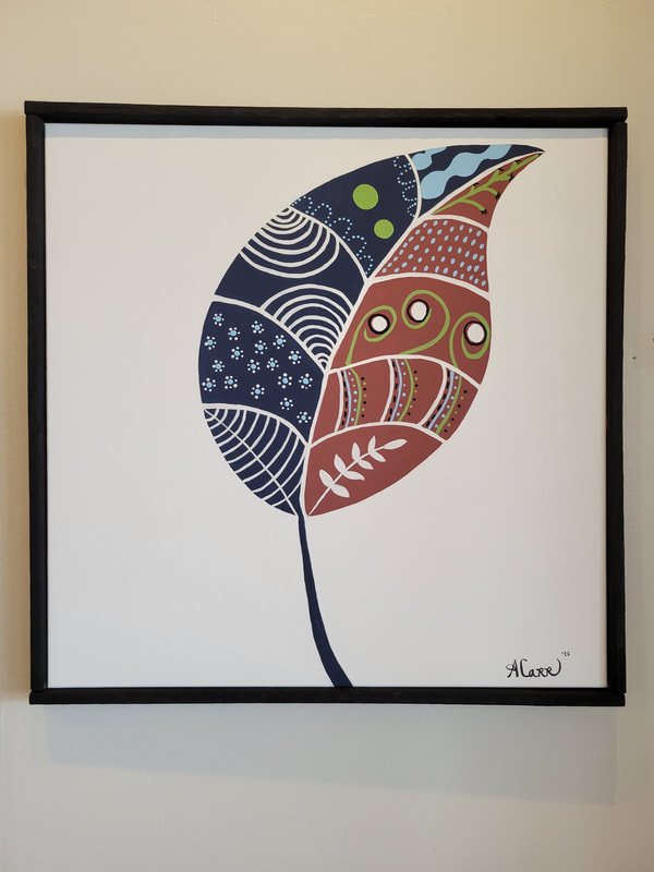 A colorful, abstract leaf artwork with intricate patterns and shapes on a white background, framed in black.