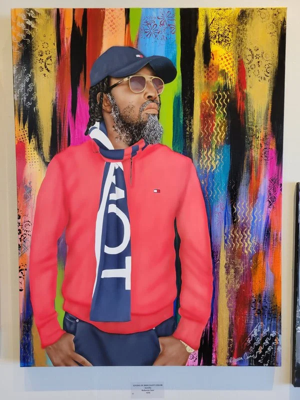 Painting of a man with sunglasses, a baseball cap, and a red Tommy Hilfiger jacket, standing in front of a colorful abstract background with vibrant streaks and patterns.