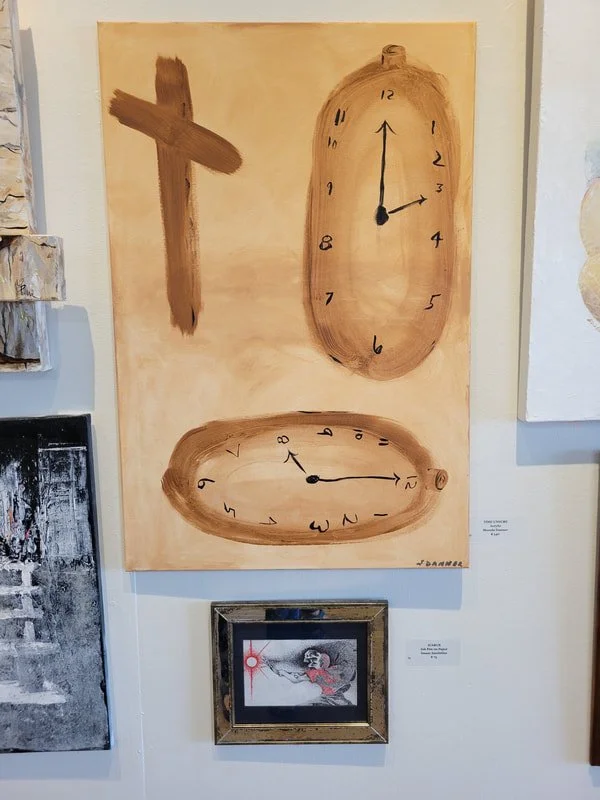 Abstract painting with two clocks and a cross on a beige background. The clock on the top shows 12:15, and the clock below shows approximately 8:00.