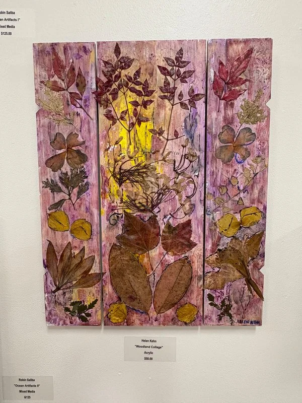 Mixed media artwork on three vertical wooden panels showing pressed leaves and flowers with a pink background and yellow highlights.