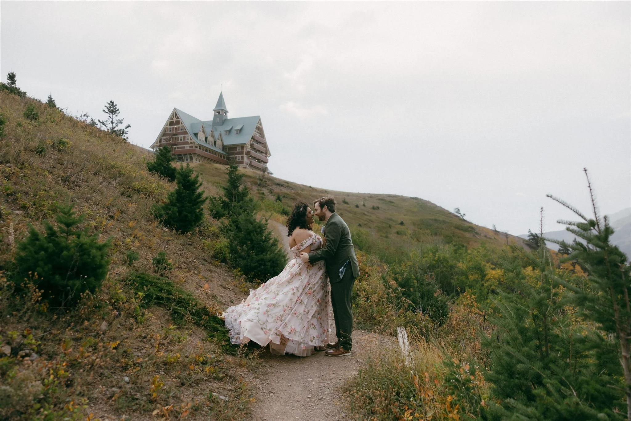 a portrait of a couple eloping and she's wearing a floral dress