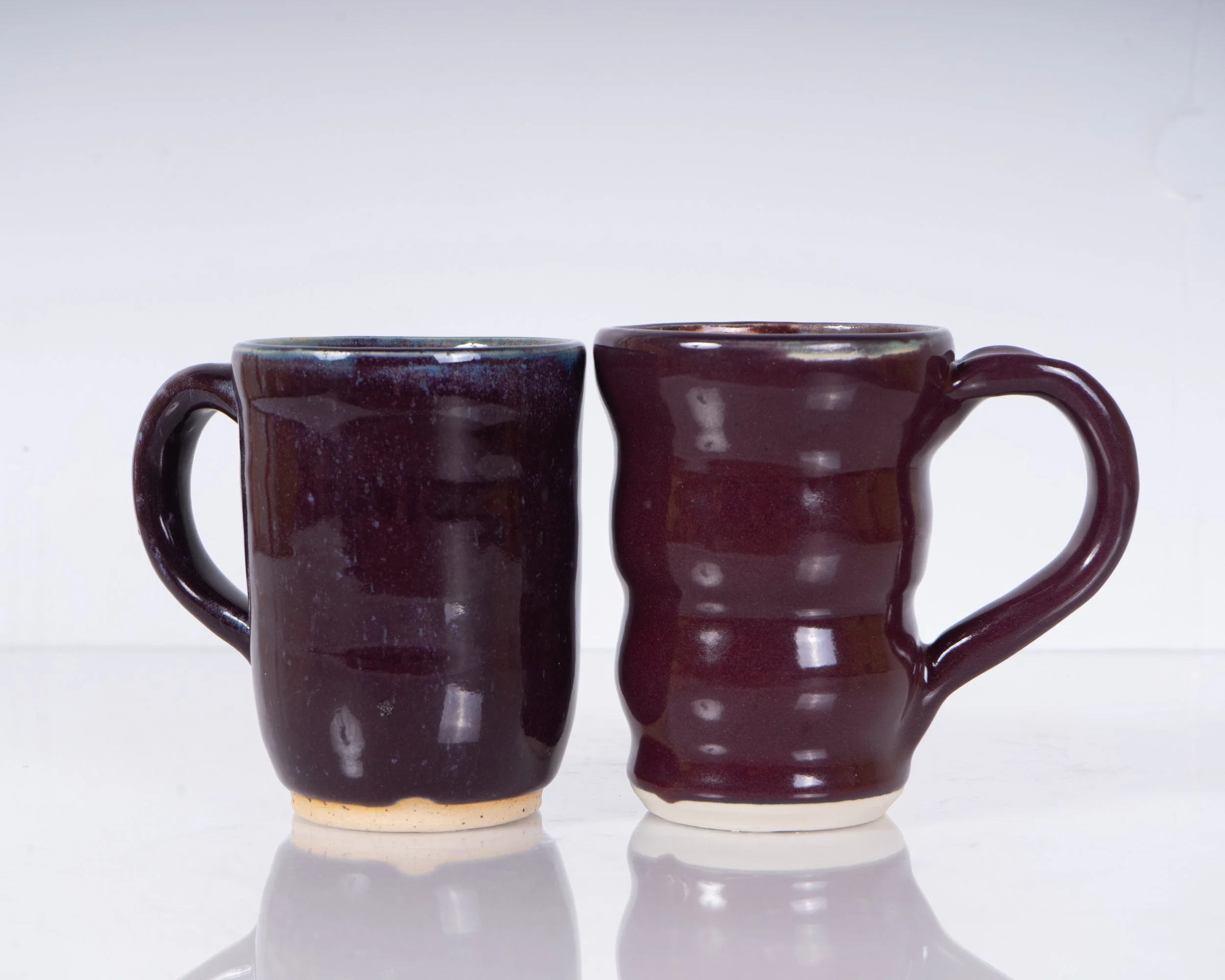Purple Mugs 
H- 4"
Stoneware 
Cone 7 Reduction
