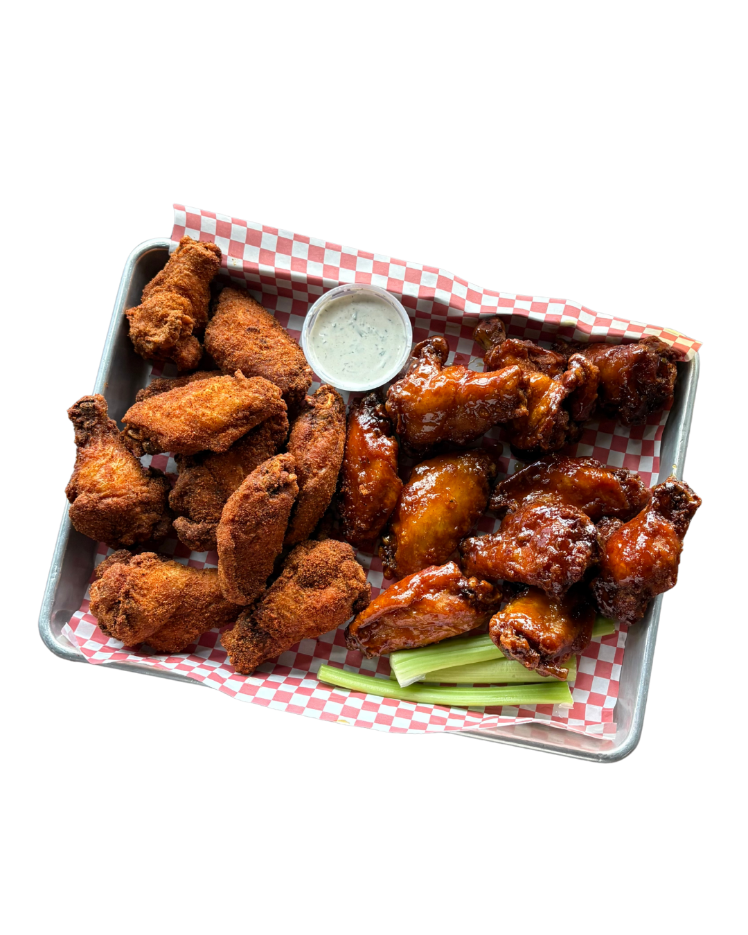 A tray of fried chicken wings, buffalo wings, and chicken tenders with a side of ranch dressing.