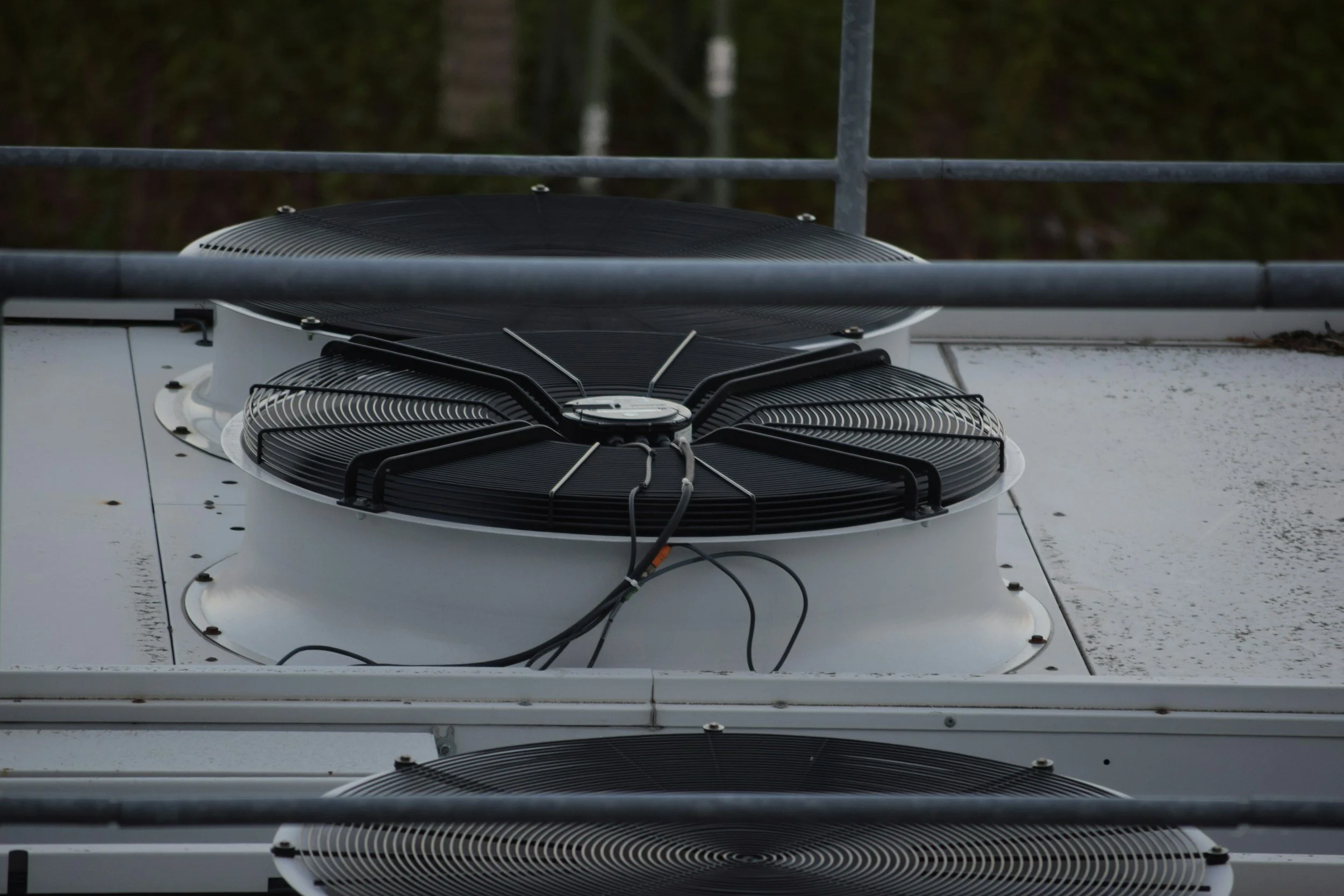 Three ventilation fans on HVAC units.