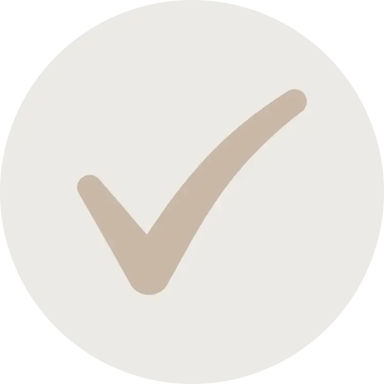 A white circle with a beige check mark in the center.