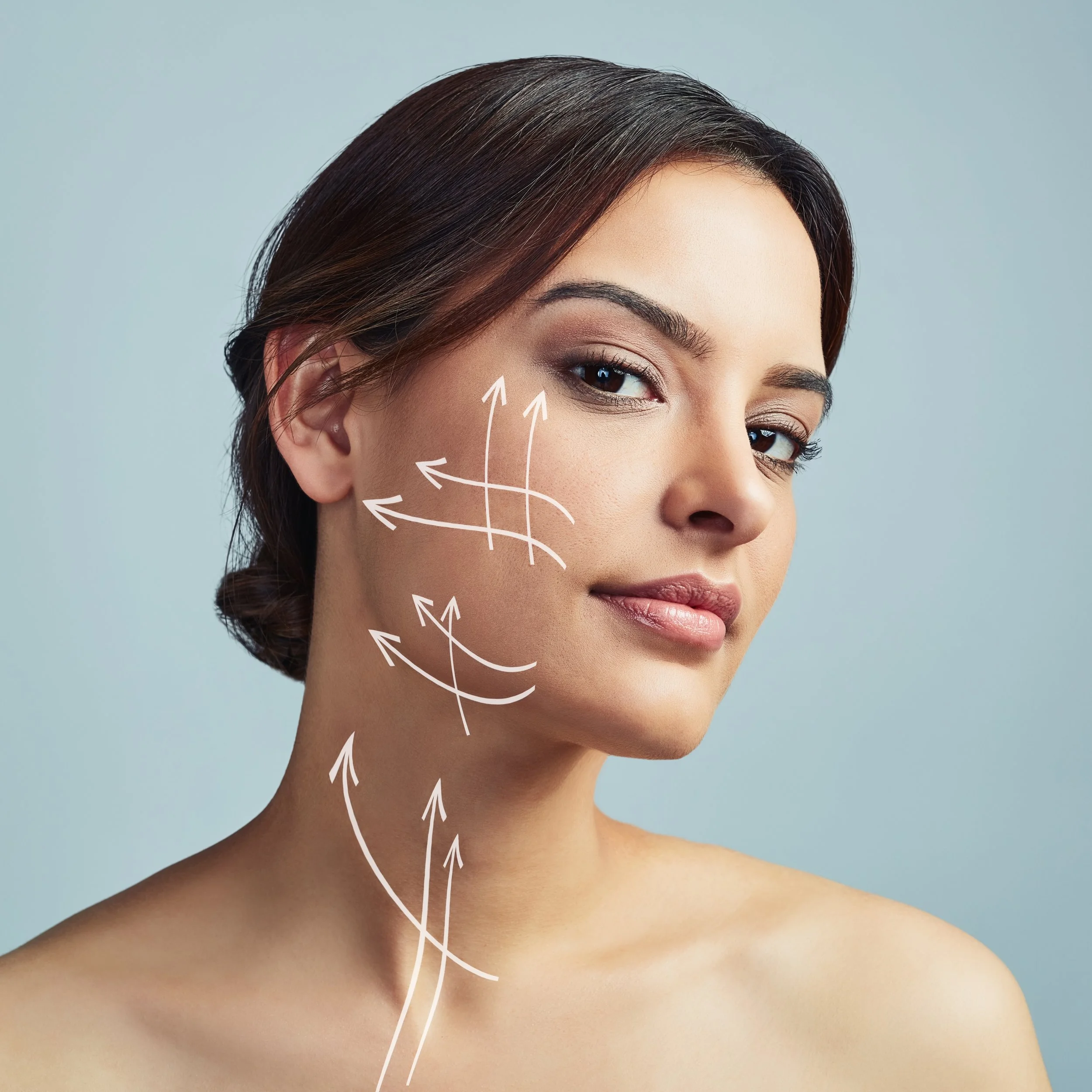 Planning with  white arrows drawn on her face and neck indicating areas of focus for skincare or cosmetic treatments.