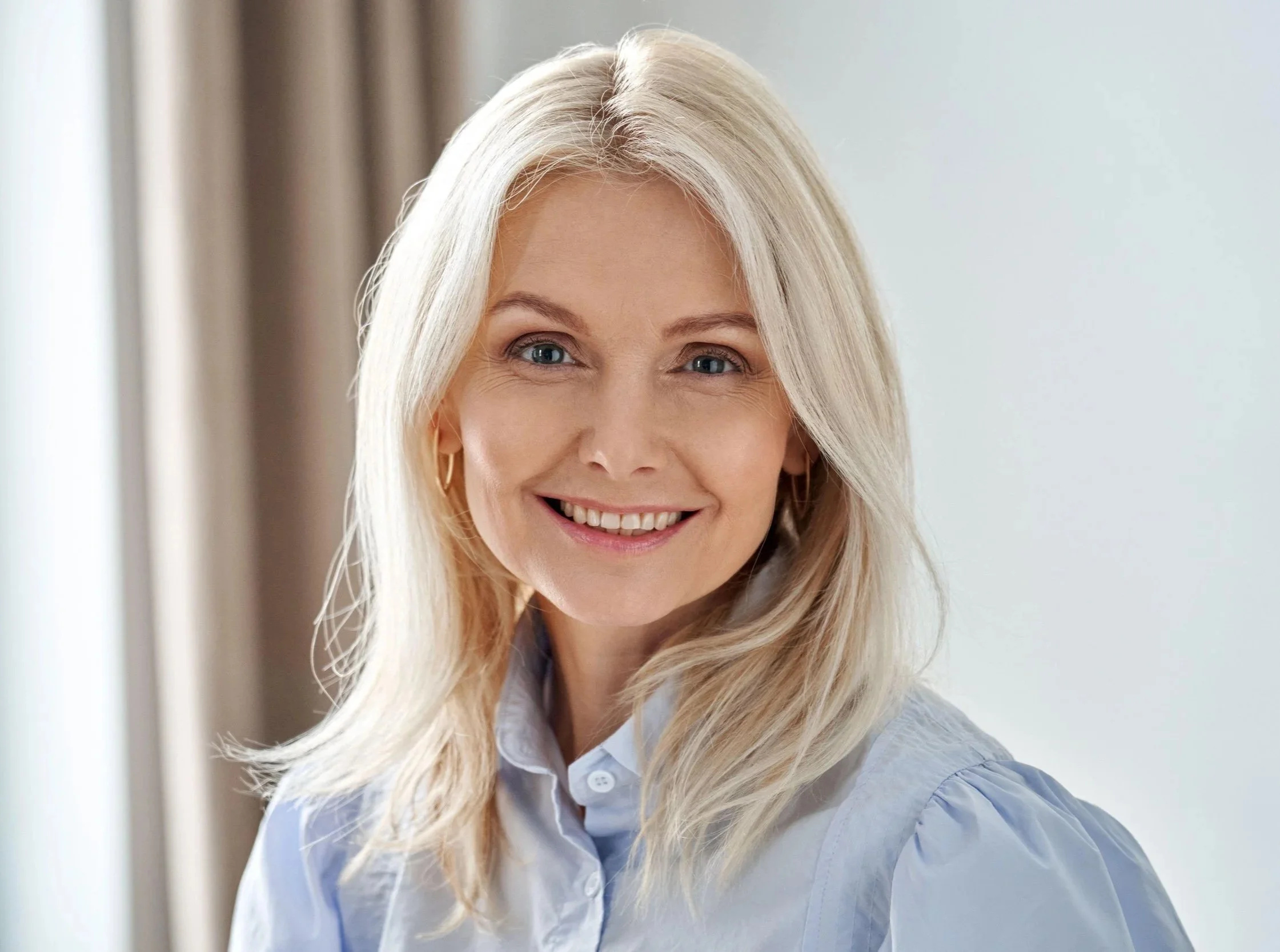 Smiling patient discussing her options for subtle aesthetic treatments