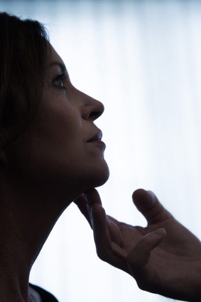 Expert doctor examining patient for cosmetic procedure.