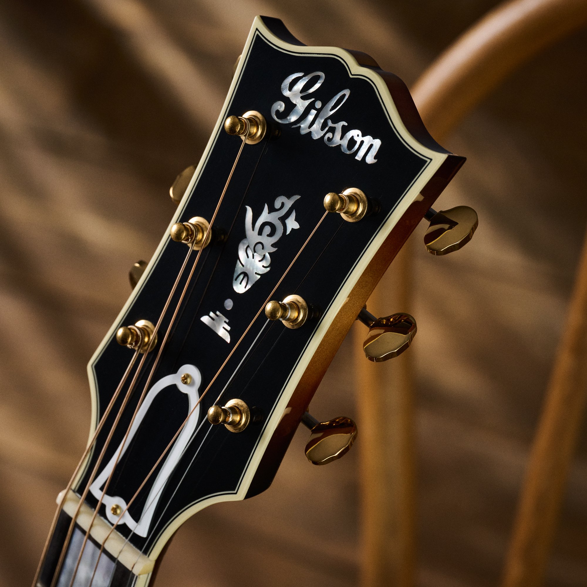 gibson sj-200 western classic acoustic guitar  vintage sunburst headstock inlay gold hardware daniel boyd commercial product photography 