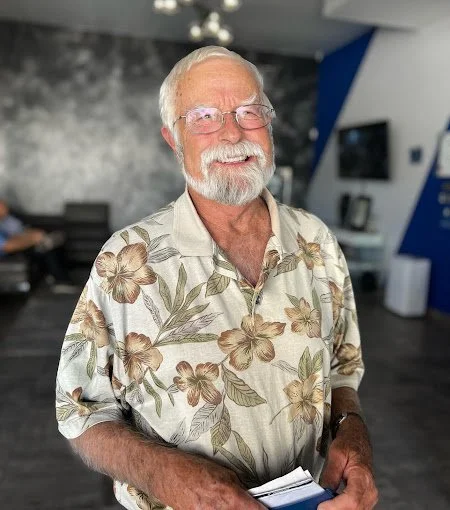 Happy All-on-6 dental implant patient smiling after full-arch restoration treatment