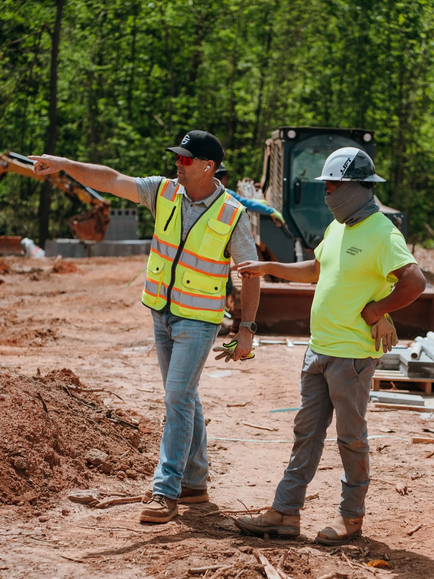 Flush Group septic technicians directing work on a residential job site in Upstate South Carolina