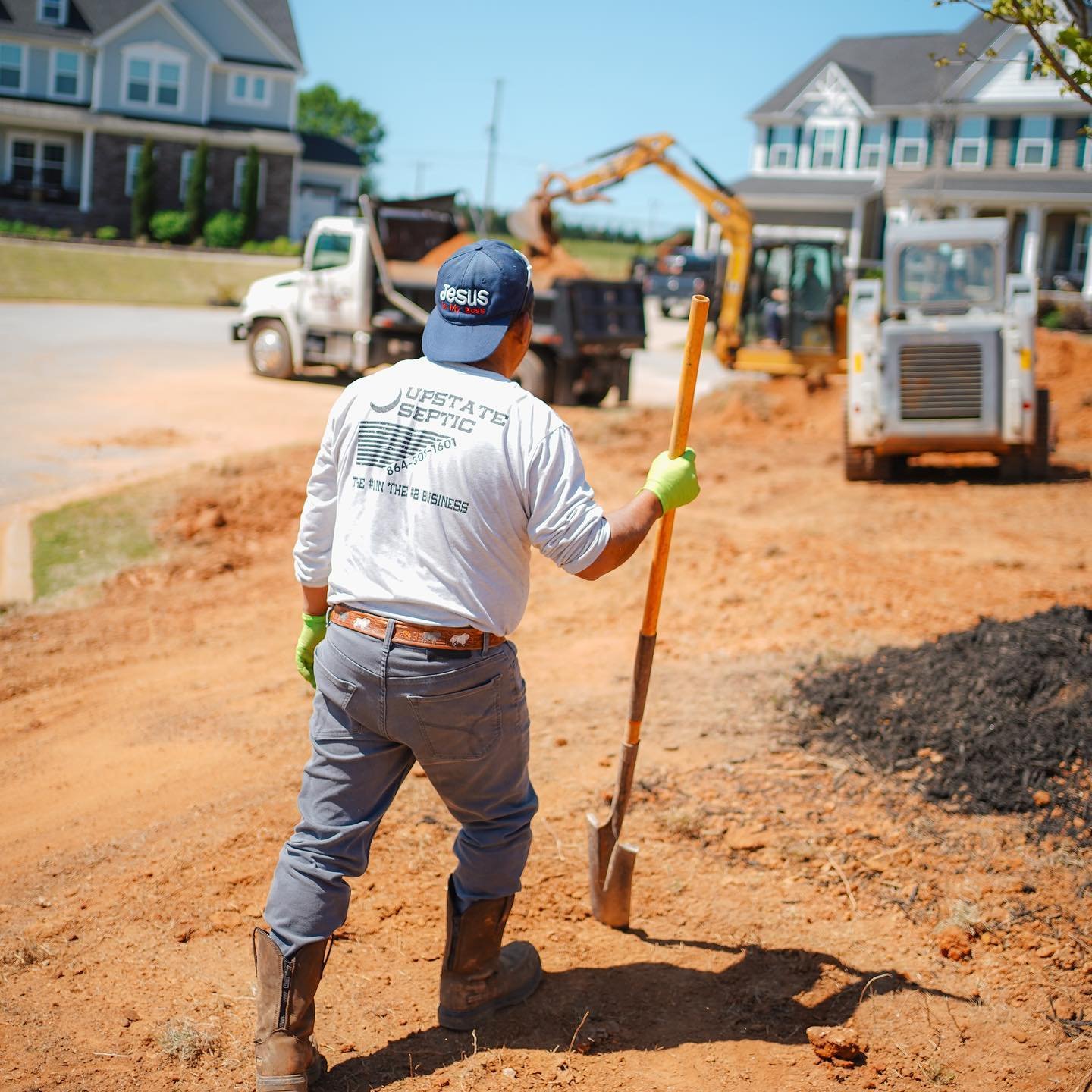 New septic system installation with excavation equipment at a residential property in South Carolina