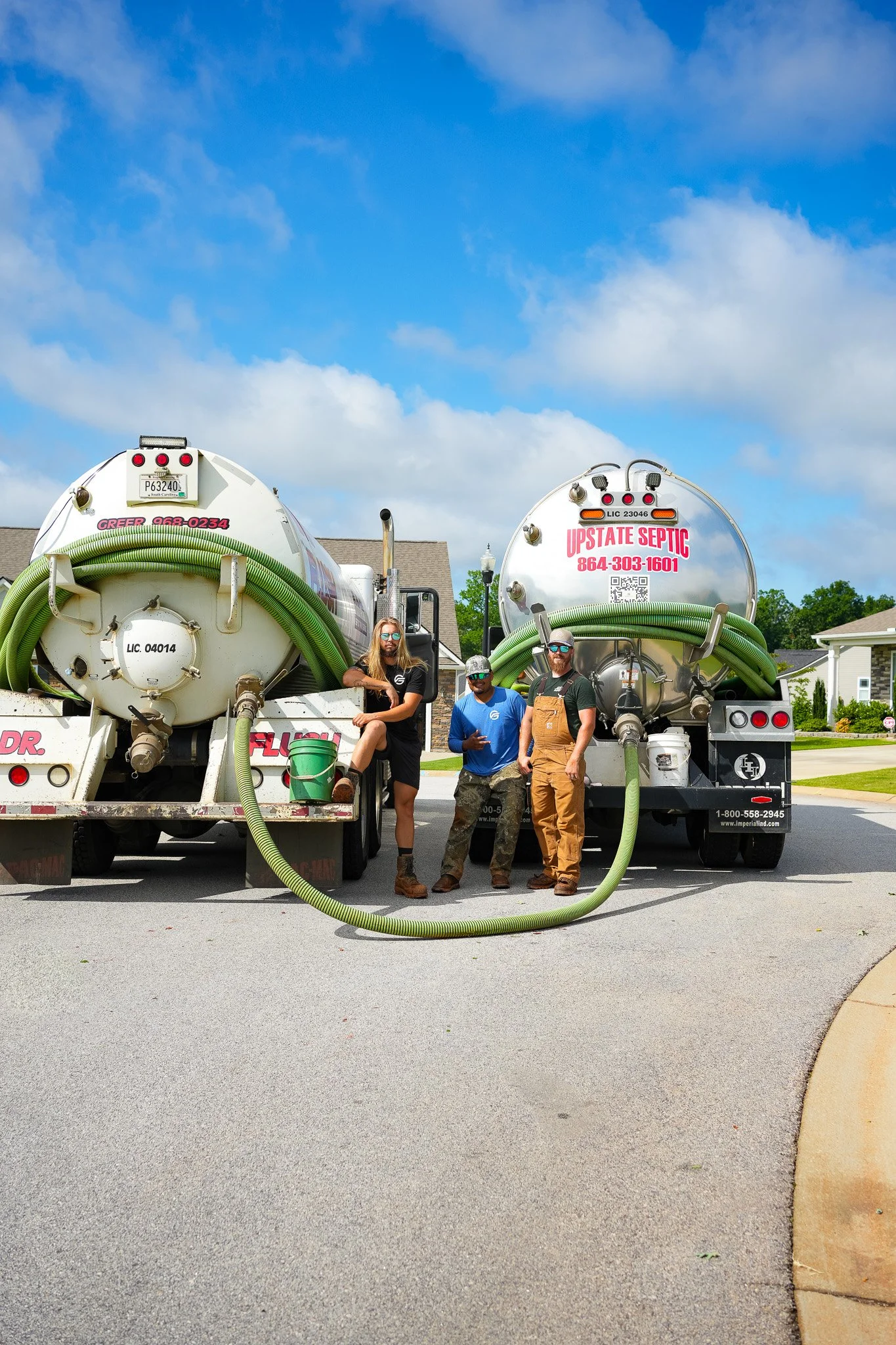 Upstate Septic Tank crew standing in front of service trucks in South Carolina