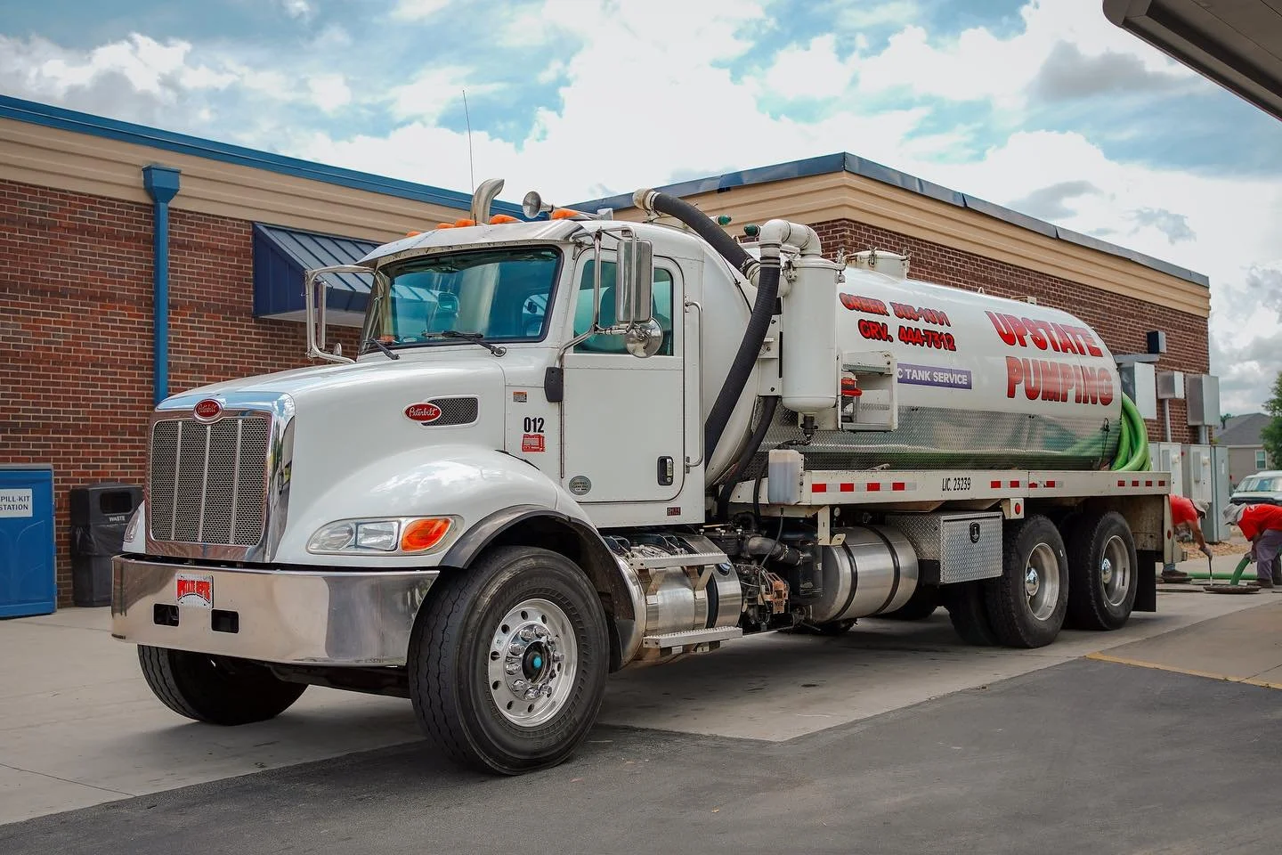 Large commercial septic service truck performing grease trap maintenance in South Carolina