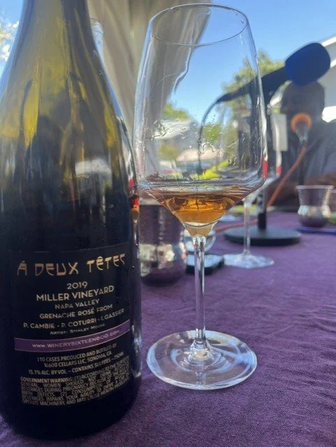 2019 A Deux Tetes Grenache Rosé  next to a glass