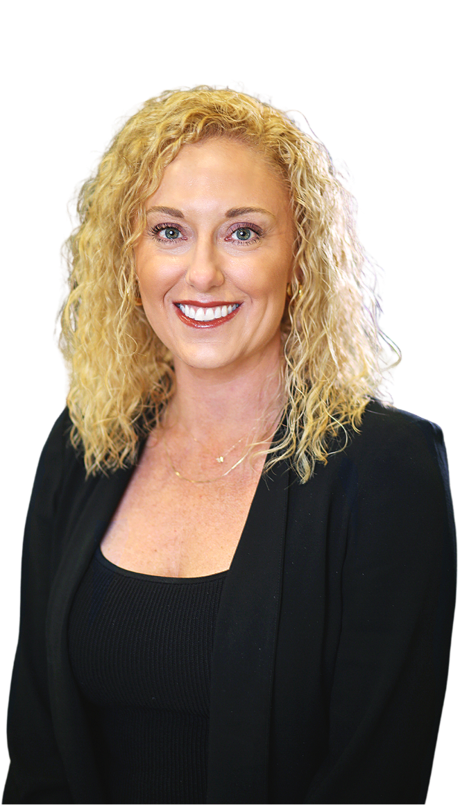 A smiling woman with curly blonde hair wearing a black top and blazer, accessorized with a gold necklace.