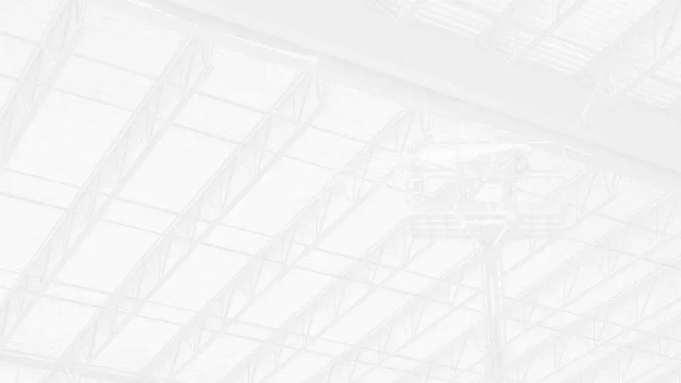 Empty warehouse with a high ceiling and visible steel beams.