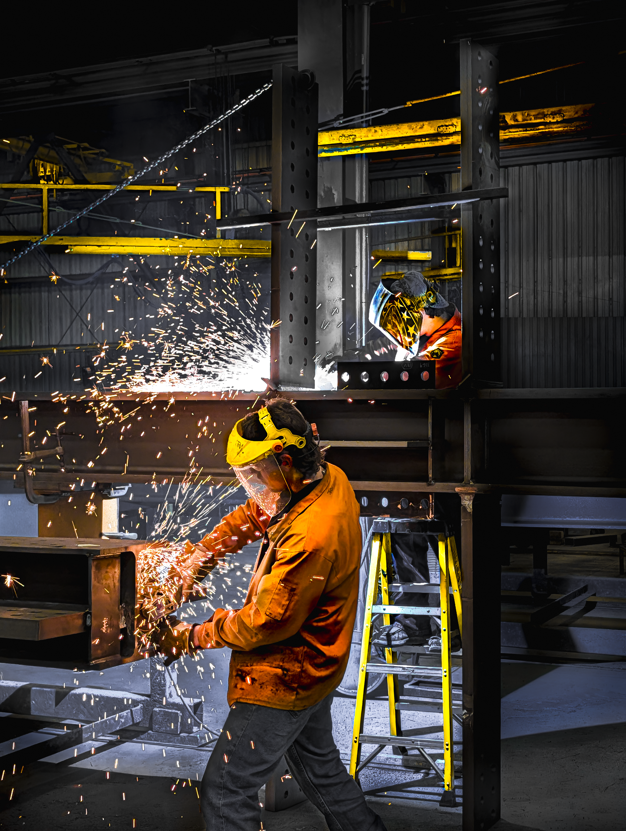 Welder wearing safety gear welding metal structure, sparks flying, industrial workspace with steel framework and ladder.