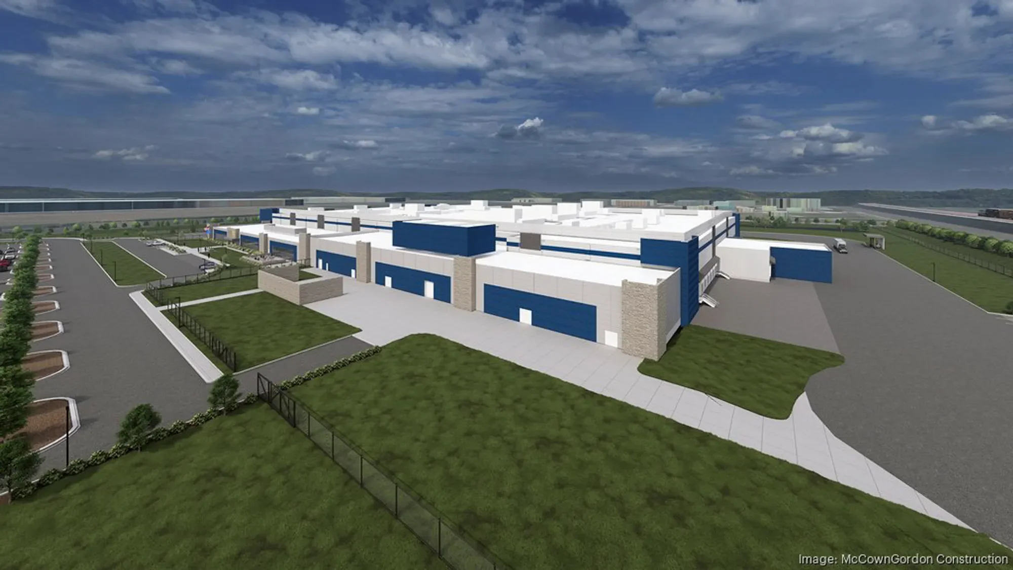 A computer-generated rendering of a large modern warehouse or distribution center with blue and white exterior, surrounded by parking lots and green landscaping, under a partly cloudy sky.