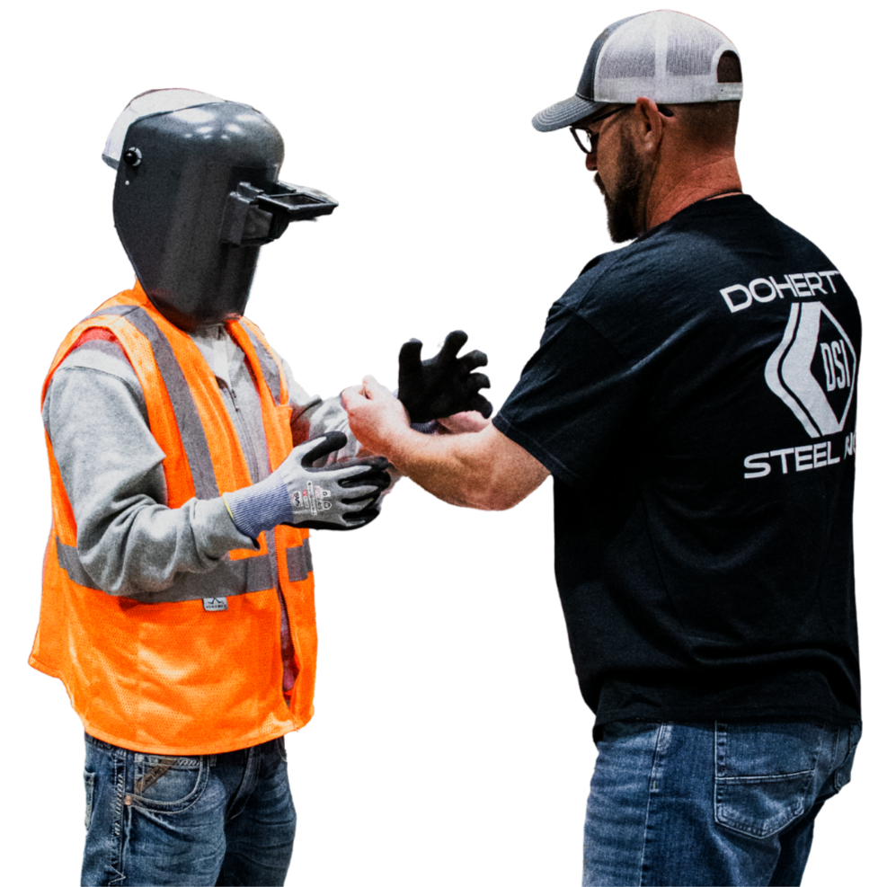 A man in a black shirt and gray cap receiving a vaccination from a person in a gray helmet and orange safety vest.