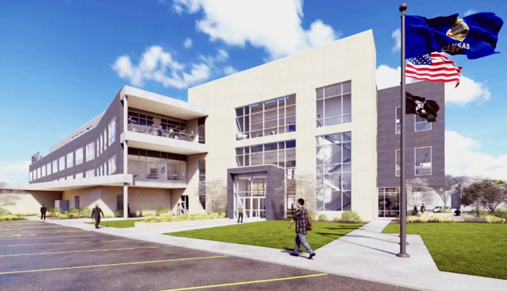A modern multi-story building with large glass windows, a parking lot with yellow lines, and flags of Kansas, the United States, and a black flag with a skull and crossbones.