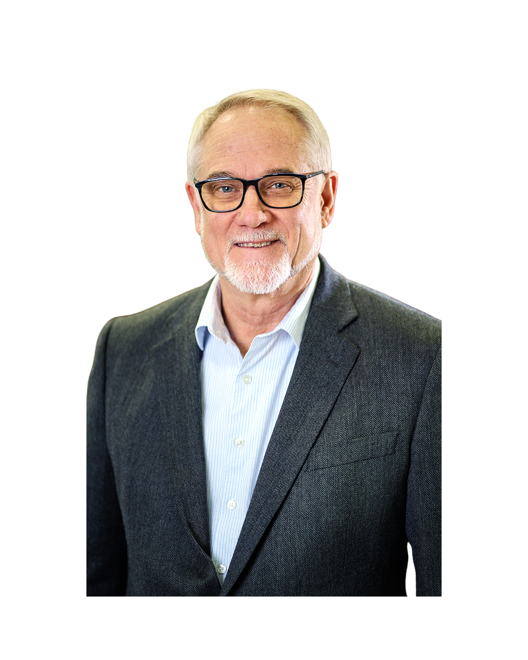 A portrait of an older man with glasses, gray hair, a beard, wearing a gray suit and a light blue collared shirt, smiling at the camera.