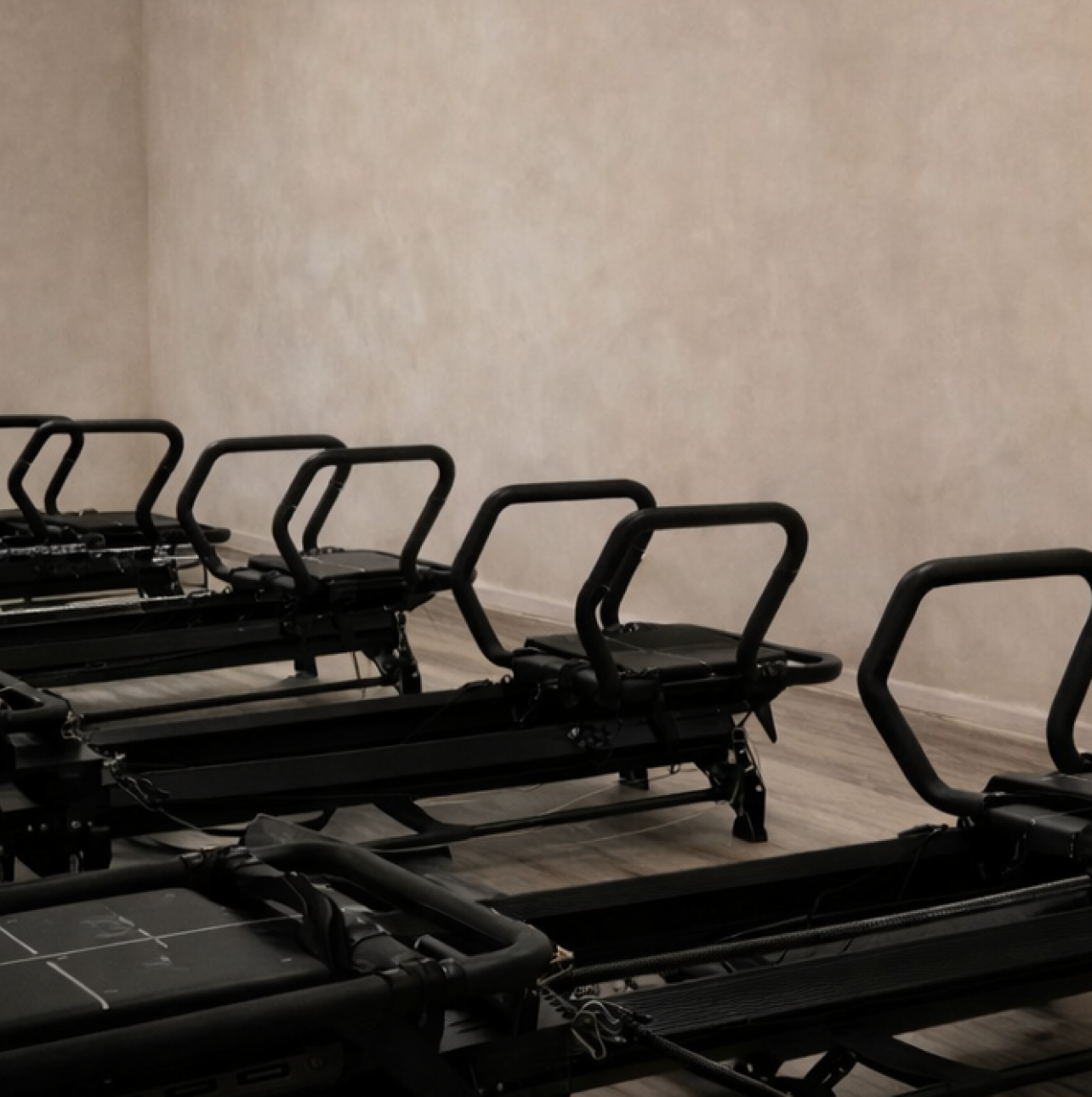 Megaformer machines on the studio floor at Form Haus, a Lagree fitness studio in Seaford, NY