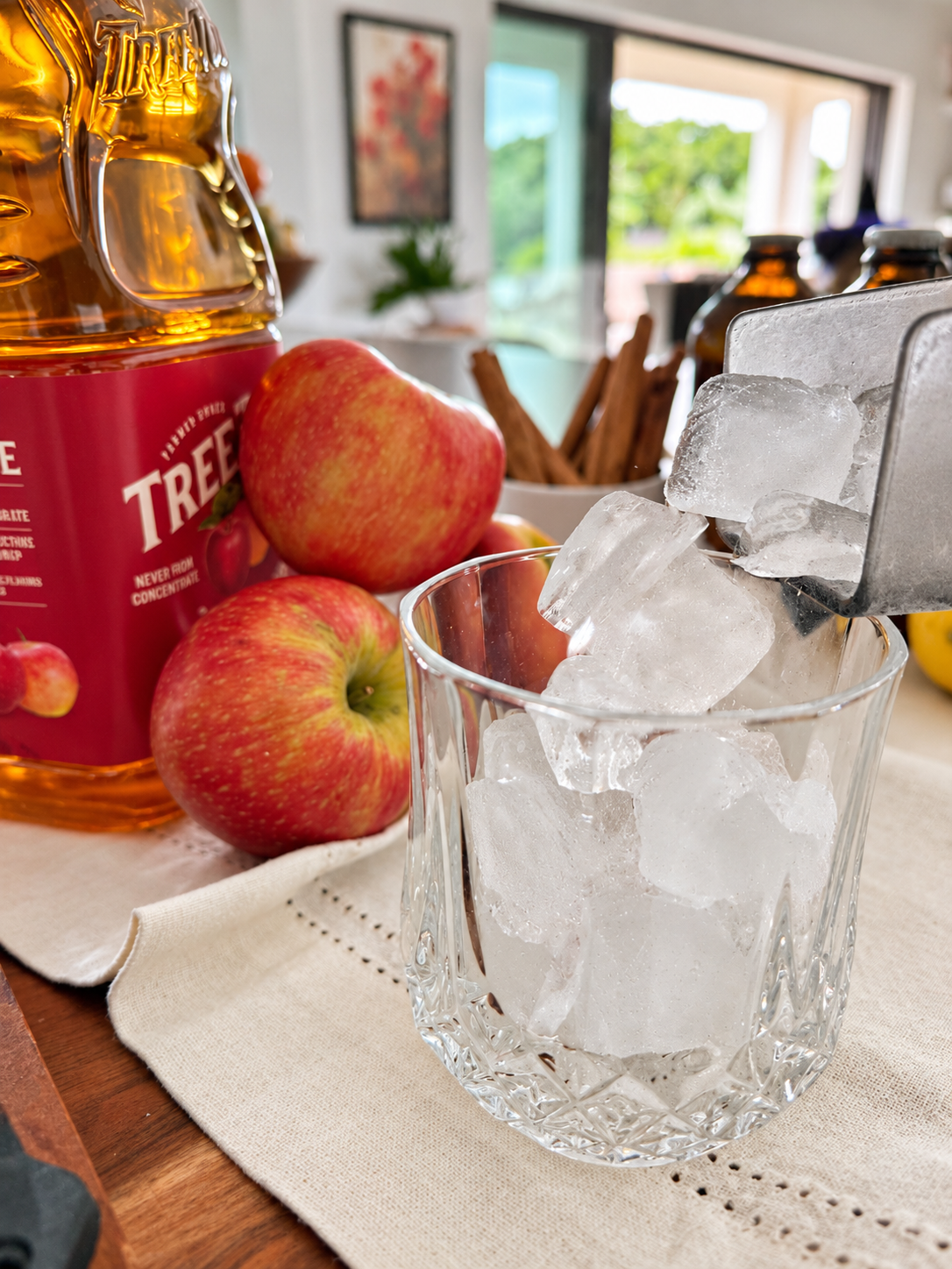 Cider poured over ice with apples-1.png