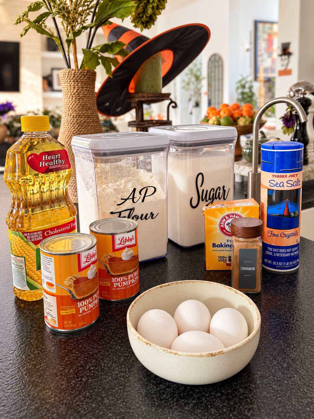 Pumpkin cake ingredients with a witch hat-1.png