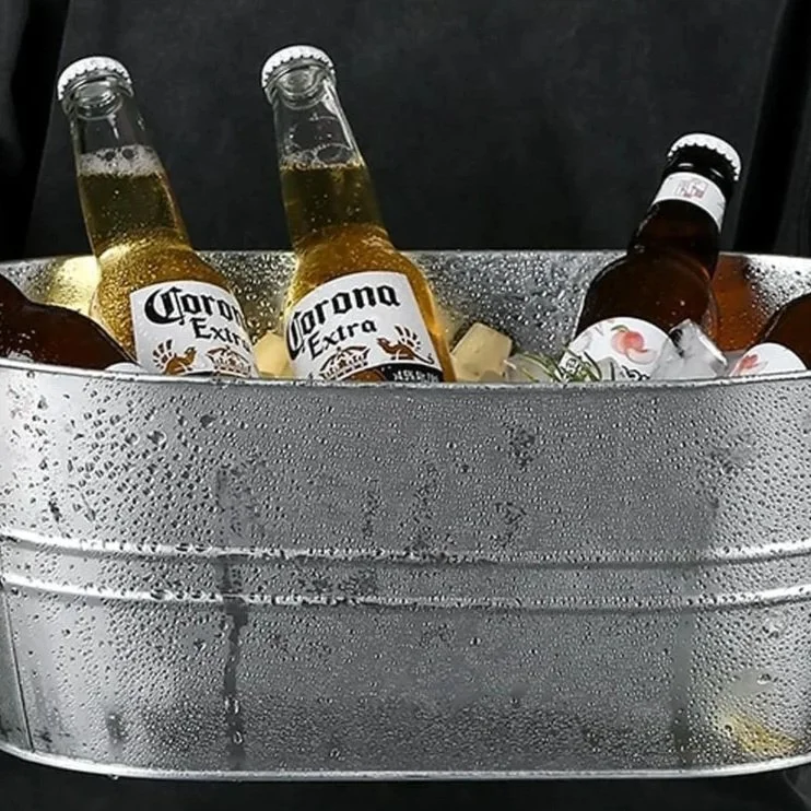 Bottled drinks chilled in a galvanized metal drink tub