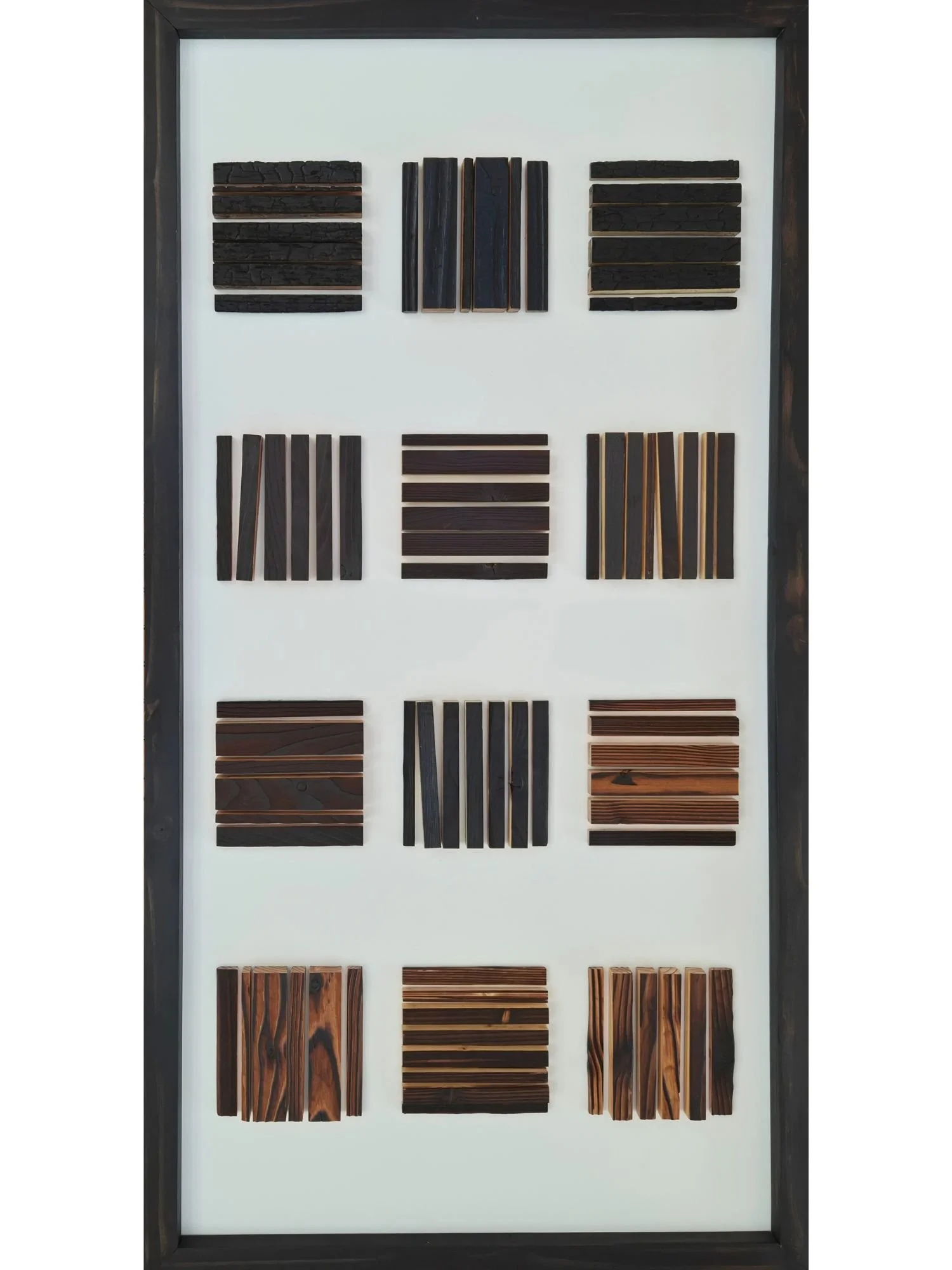 tableau-bois-geometrie-graphique-bois-brule-nuances-de-feu-lignes-profondeur-matiere-cadre-symetrie-courbes-composition-art-mural.jpg