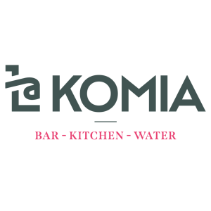 Kuvassa on logo, jossa lukee 'KOMIA' ja alaosassa 'BAR - KITCHEN - WATER'.