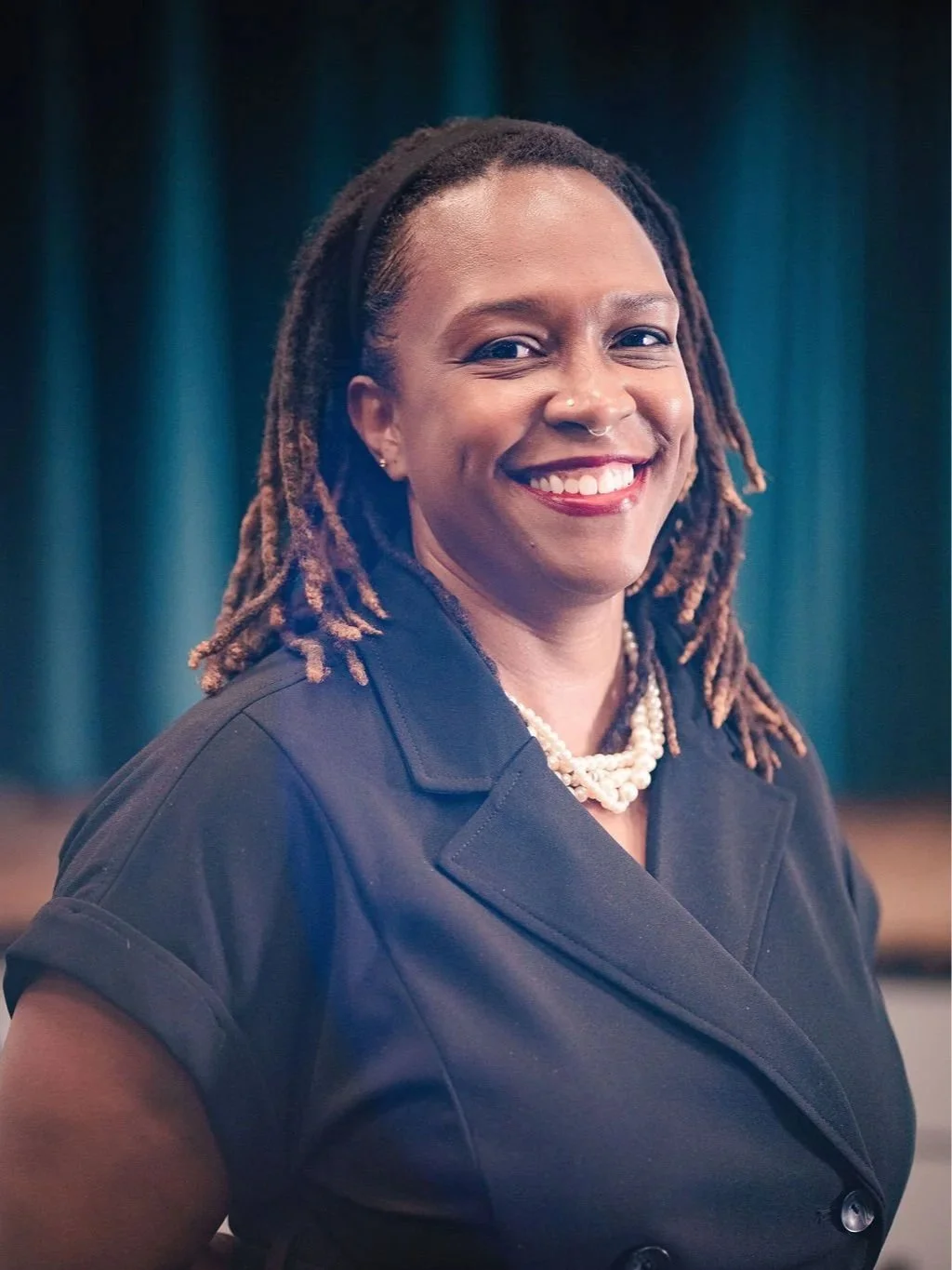 Dr. Clarece Weinraub smiling warmly – Founder of VibeCheckCo and culture consultant helping Los Angeles schools and nonprofits.