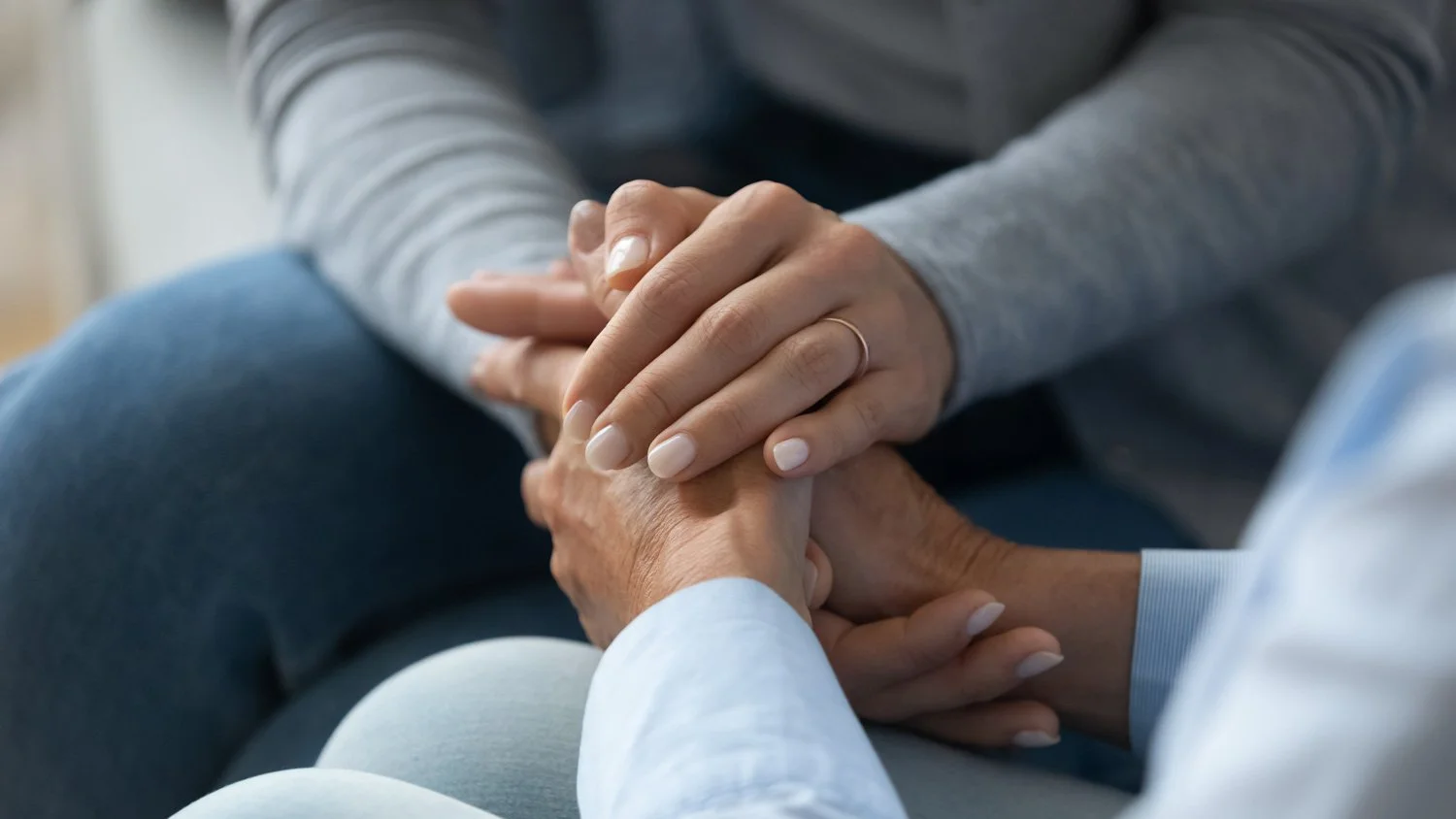 Person holding hands offering support during estate administration