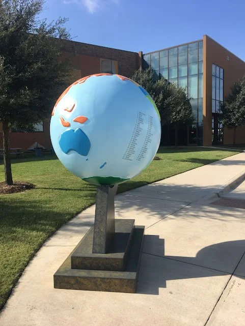 Geometric drawing of an outline square with sections divided by vertical, horizontal, and diagonal lines.