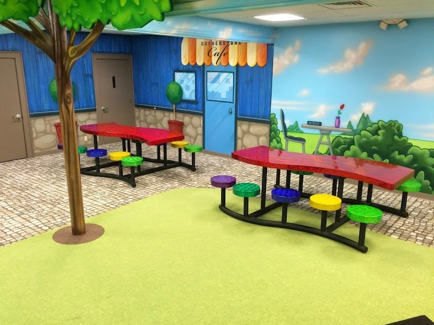 Geometric drawing of an outline square with sections divided by vertical, horizontal, and circle lines.