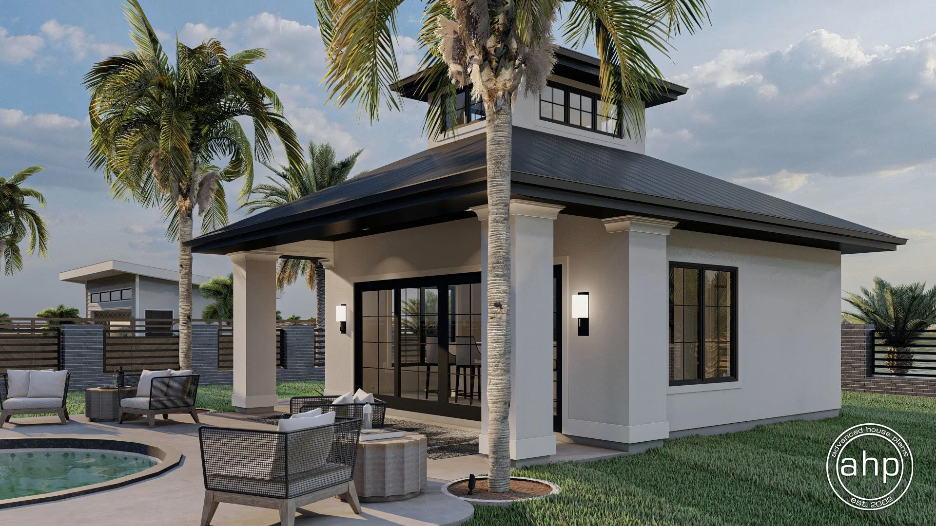 Modern two-story house with white exterior walls, black roof, and large black-framed windows, surrounded by palm trees and outdoor seating, with a small pool and a grassy yard.