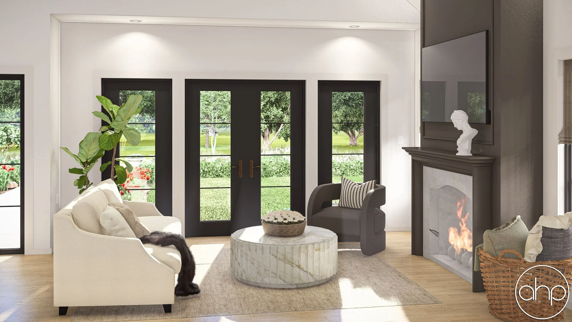 Living room with a cream sofa, a black armchair, a round marble coffee table with a flower arrangement, a fireplace with a bust sculpture on the mantel, large windows showing a garden with trees and shrubs, and light wood flooring.