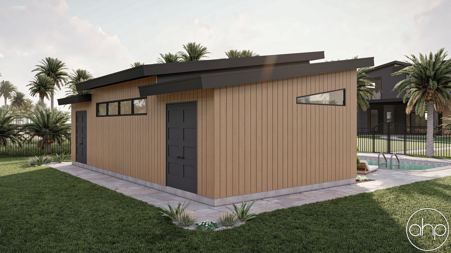 A modern backyard shed with wooden siding, a black door, and a narrow horizontal window, next to a swimming pool with a metal ladder, surrounded by a grassy lawn, palm trees, and a black metal fence.