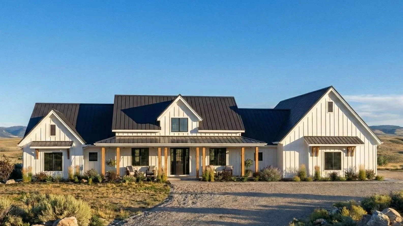 Crestwood modern farmhouse with white board-and-batten siding and black metal roof