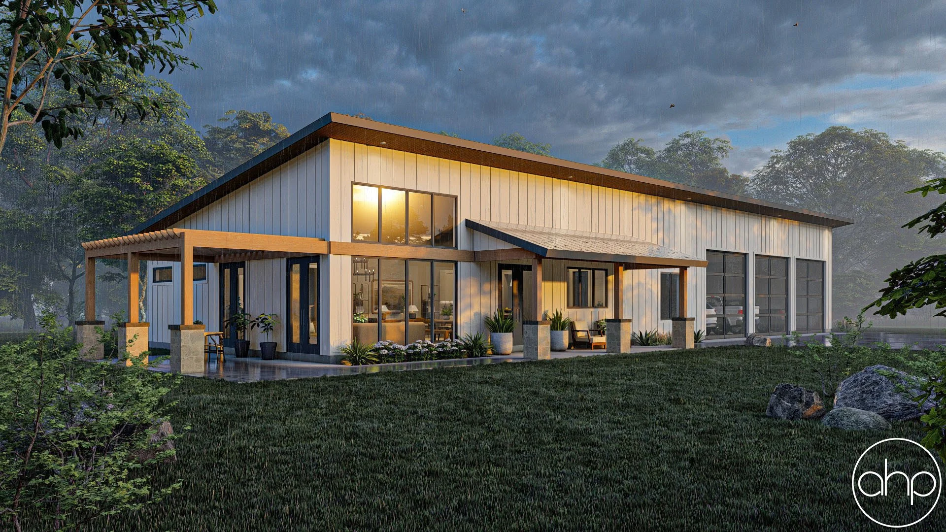 Modern white house with large windows, wooden accents, and a covered patio, set in a lush green landscape with trees and rocks, during sunset or sunrise.