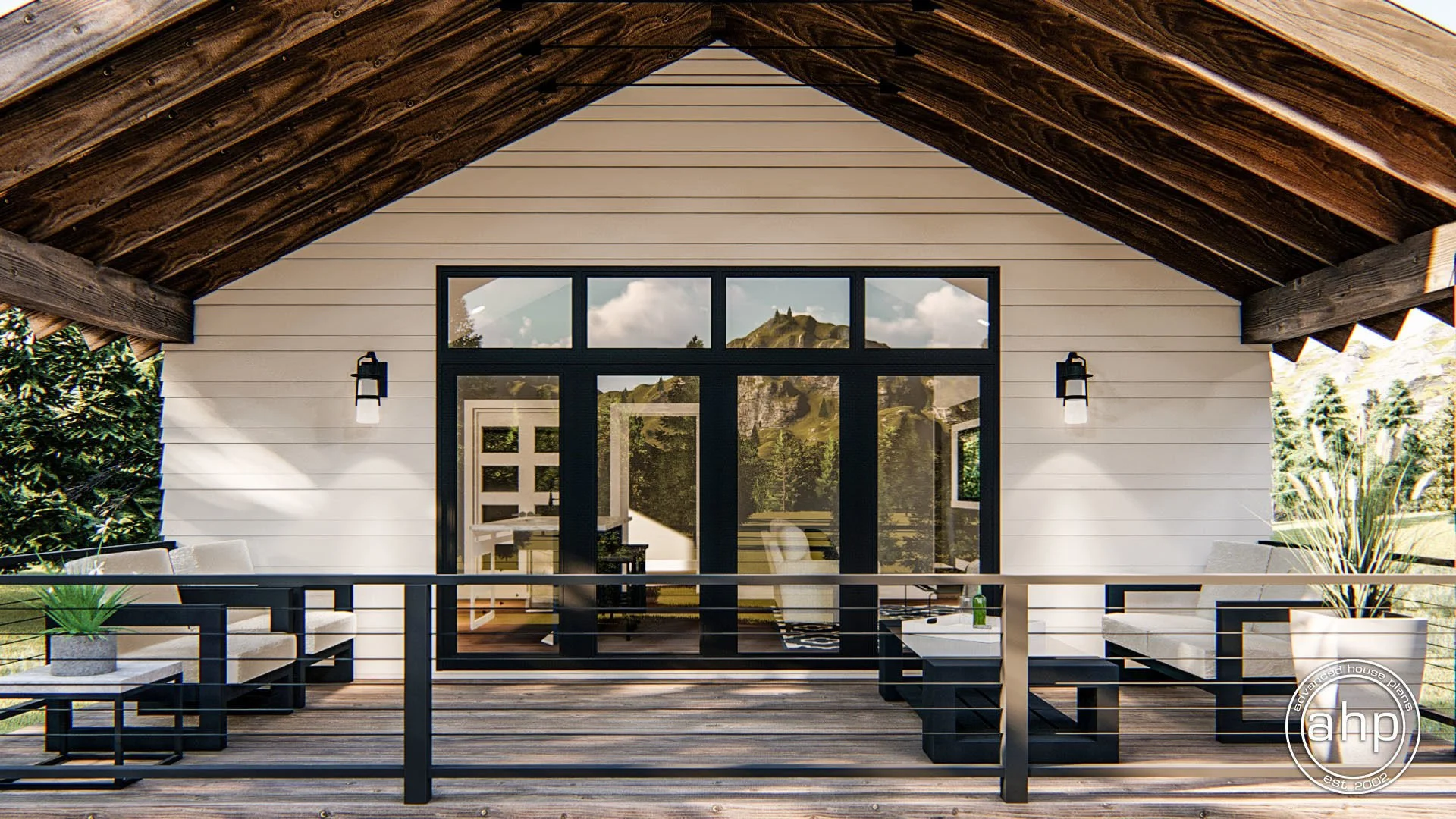 Outdoor balcony with white cushioned seating, small tables, and potted plants, overlooking a scenic view of green hills and mountain in the background.
