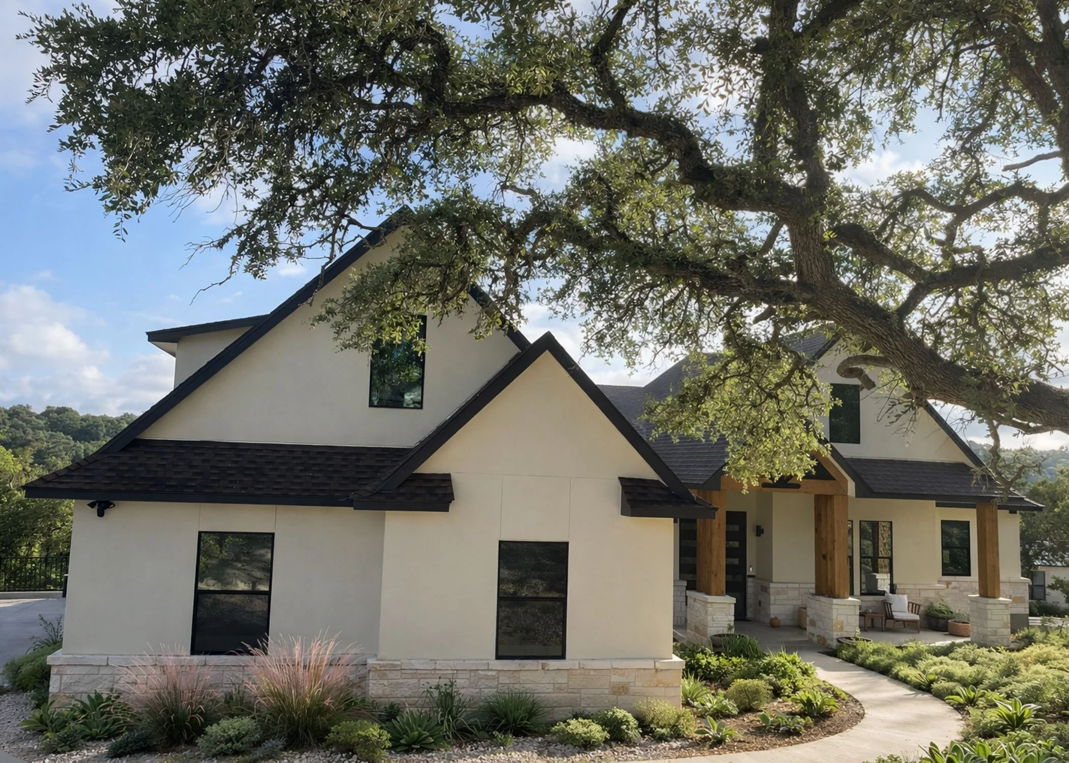Custom luxury home built by Capricorn Concepts in the Texas Hill Country featuring modern architecture, large windows, and natural stone exterior.