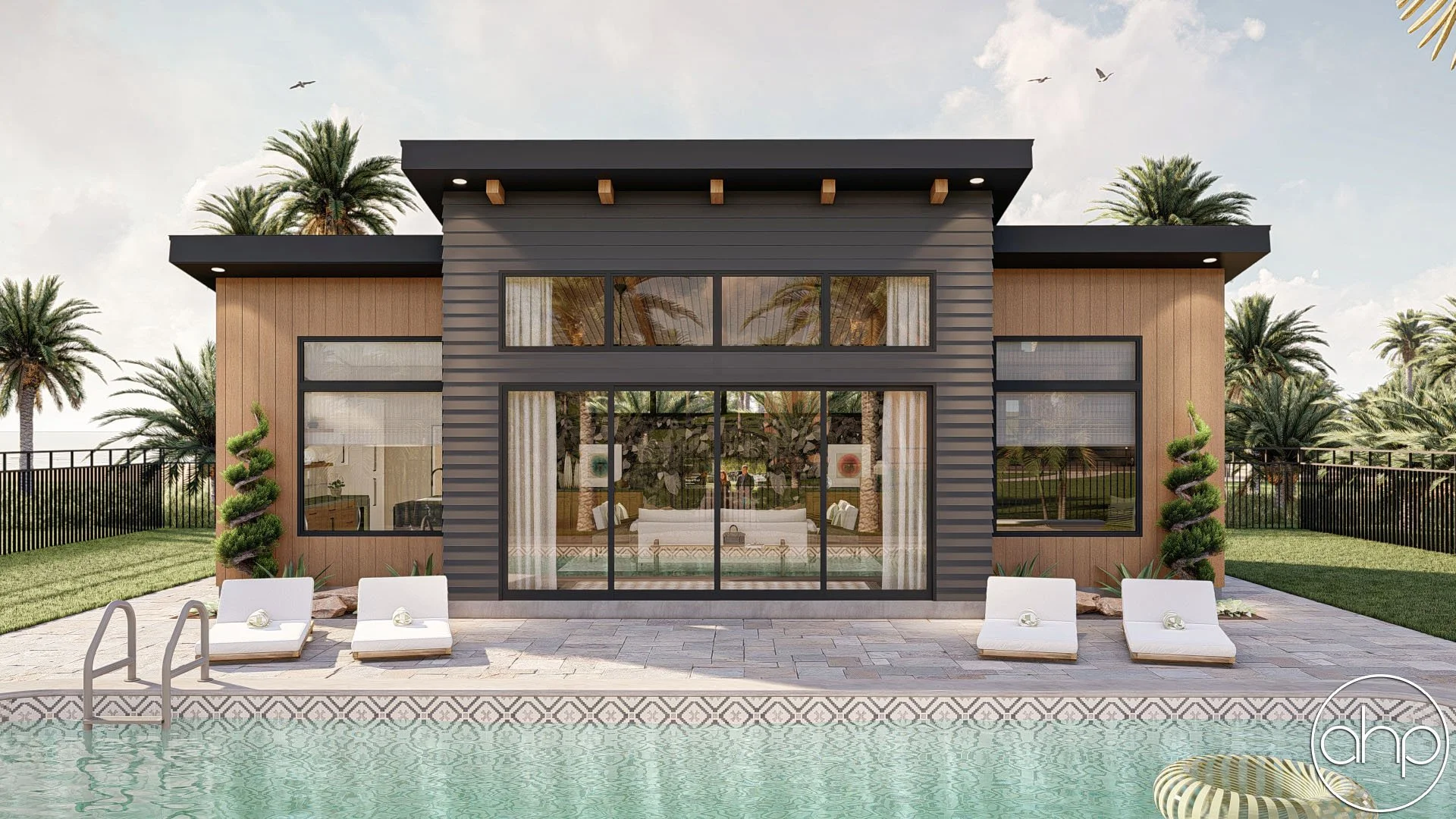 Modern house with large glass doors and windows, surrounded by palm trees, with a swimming pool in the front and poolside lounge chairs.