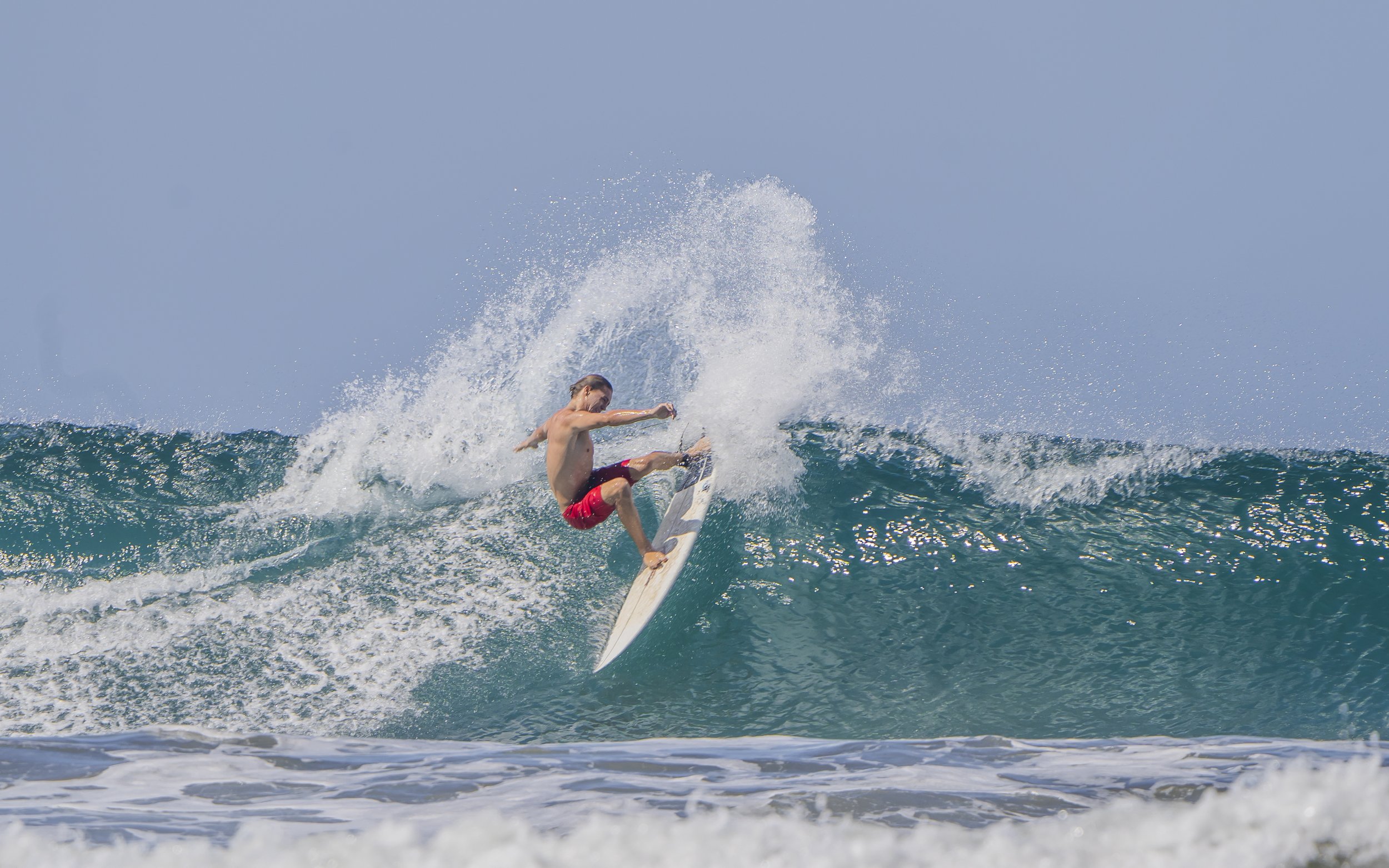 Surfing Nosara waves at the local break