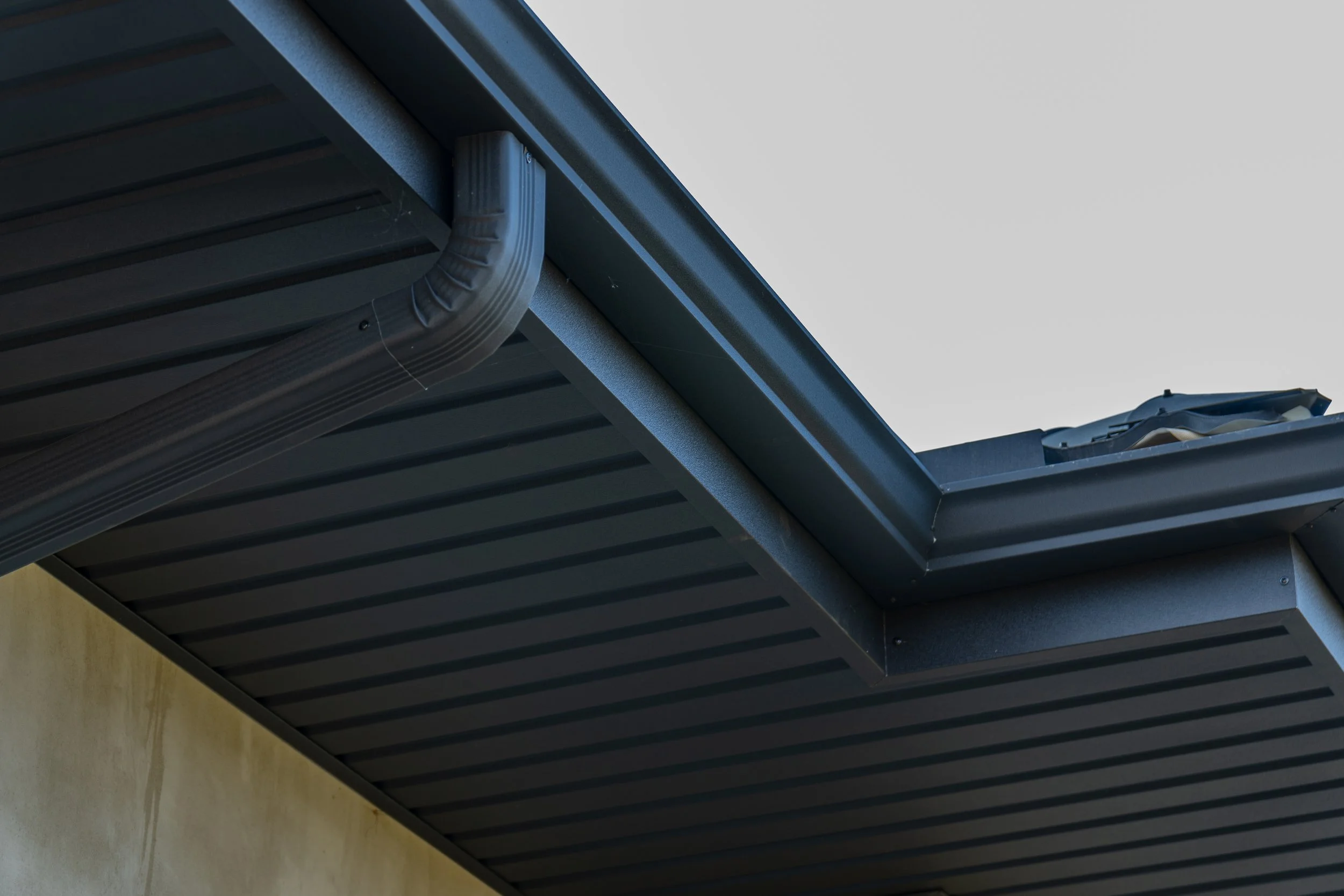 Gutter installation along the roofline for clean alignment and reliable water flow management on a residential exterior in Wisconsin.