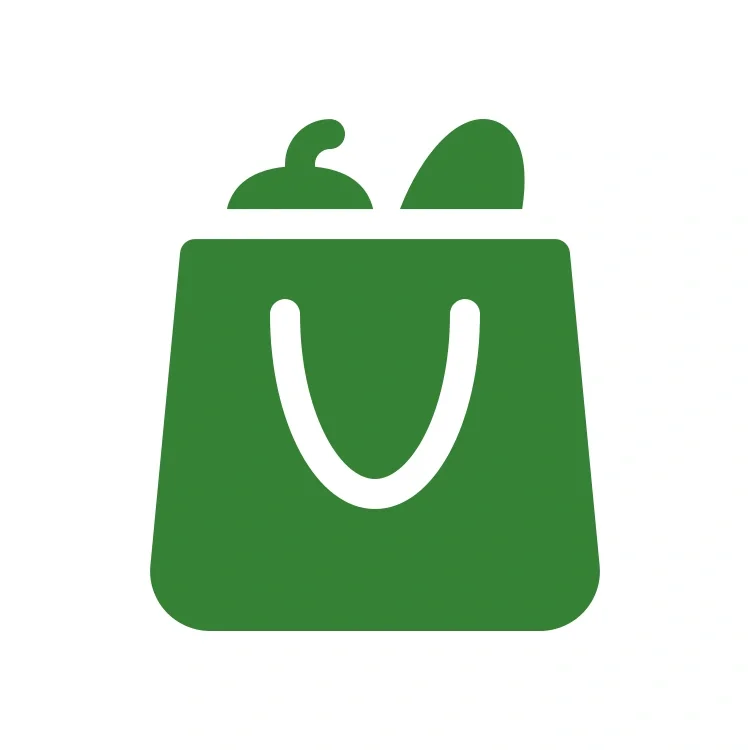Green shopping bag with a handle, containing a bottle and a loaf of bread.