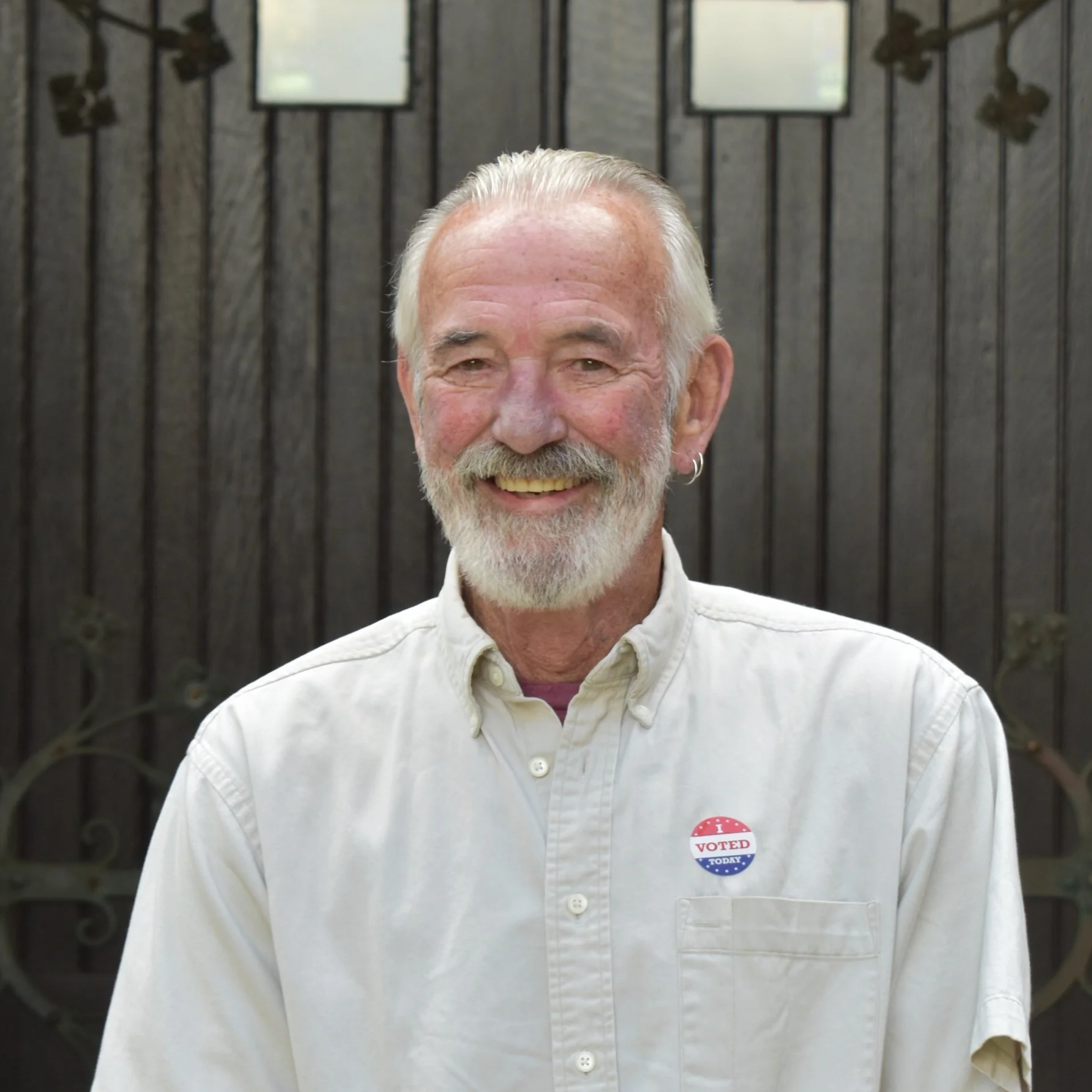 Silhouette of a person's head and shoulders in gray on a white background.