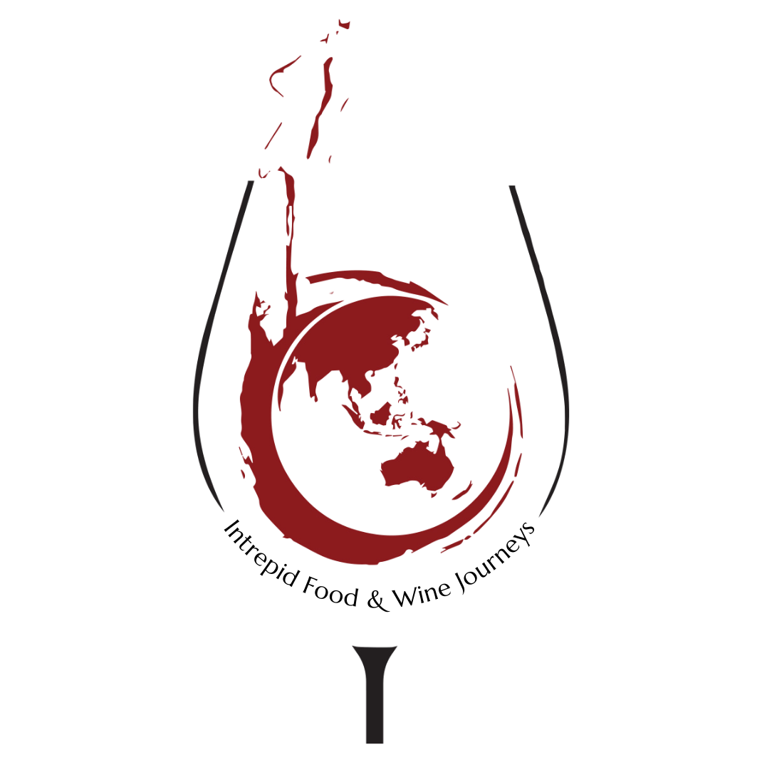 Stylized drawing of a wine glass with a splash of red wine pouring into it, showing a globe inside the wine, representing wine from around the world.