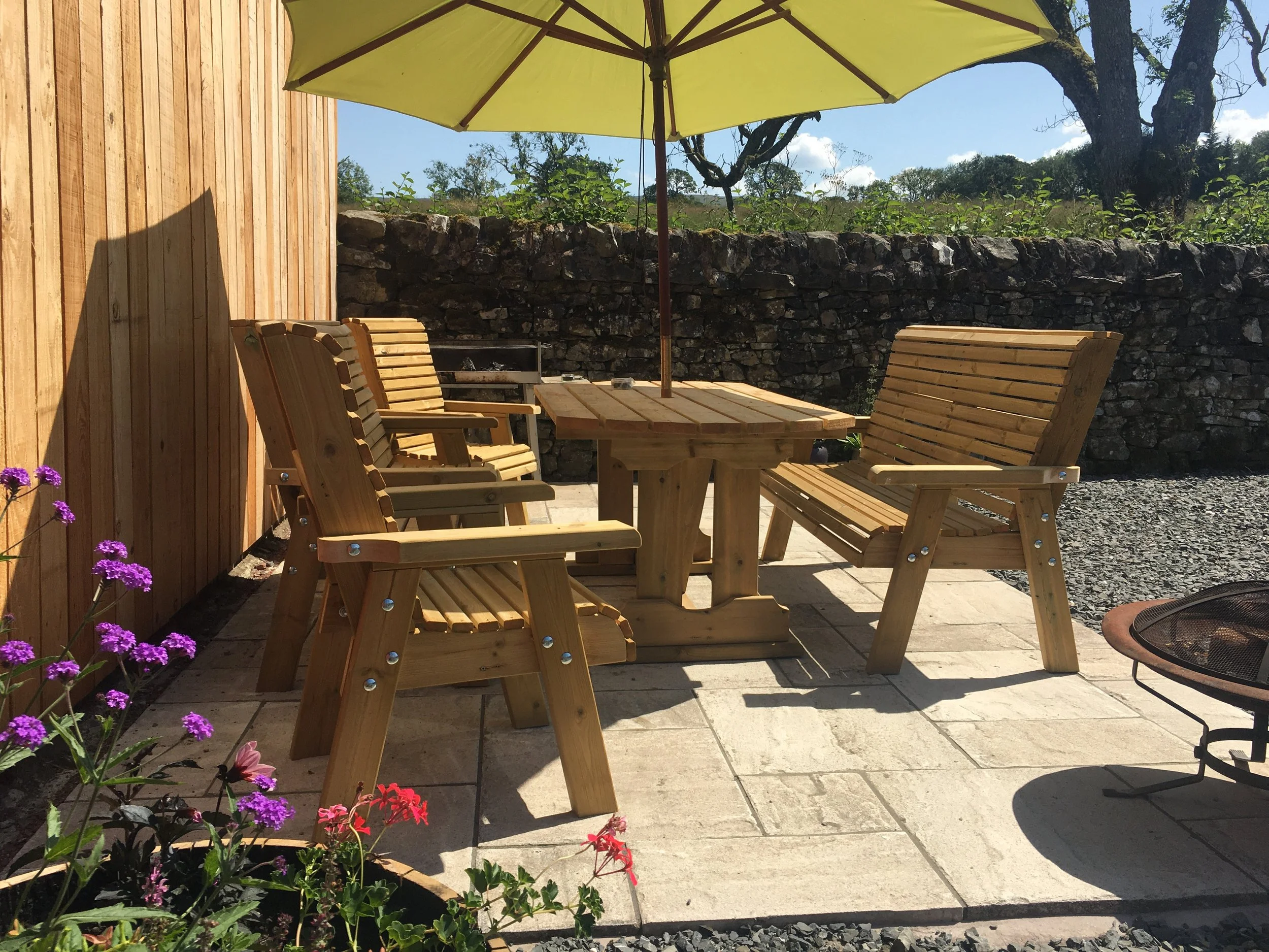 The sunny outdoor patio at Larriston Coach House